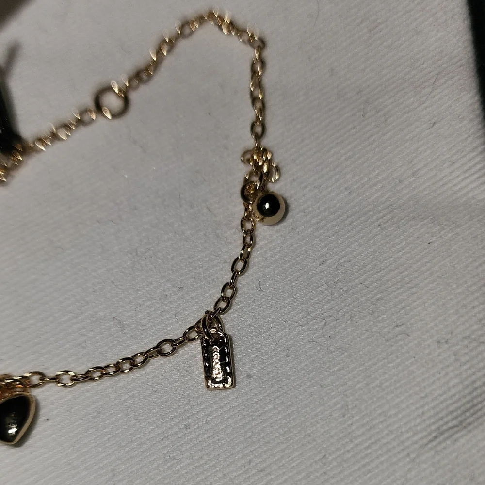 Coach Gold-Tone Delicate Charm Bracelet - Picture 6 of 7